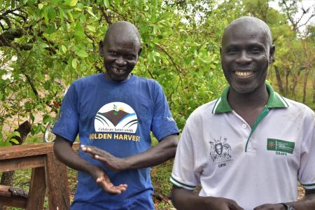 Refugee farmers, Andrew and David producing a golden harvest