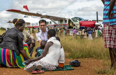 Pilot Gregory Vine preparing a patient for medical emergency