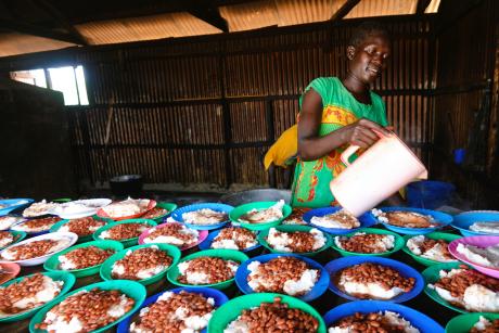 A school cook serving lunch 