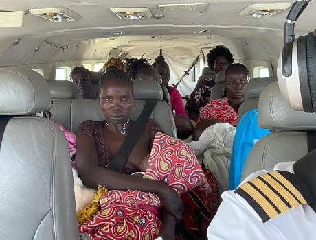 Babies and their carers aboard a MAF aircraft from Juba to Tororo airfield in Uganda